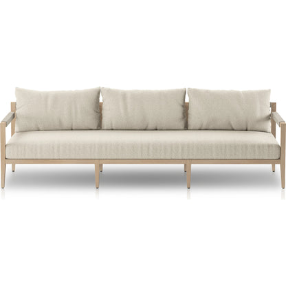 Sherwood Outdoor Sofa, Washed Brown by Four Hands. Made from 100% olefin, solid fsc®-certified teak, 100% polypropylene in a coastal style.