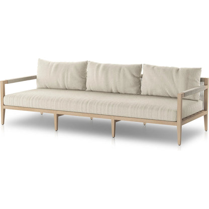 Sherwood Outdoor Sofa, Washed Brown by Four Hands. Made from 100% olefin, solid fsc®-certified teak, 100% polypropylene in a coastal style.