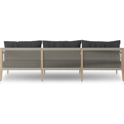 Sherwood Outdoor Sofa, Washed Brown by Four Hands. Made from 100% olefin, solid fsc®-certified teak, 100% polypropylene in a coastal style.