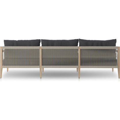 Sherwood Outdoor Sofa, Washed Brown by Four Hands. Made from 100% olefin, solid fsc®-certified teak, 100% polypropylene in a coastal style.