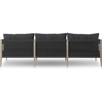 Sherwood Outdoor Sofa, Weathered Grey by Four Hands. Made from 100% olefin, solid fsc®-certified teak, 100% polypropylene in a coastal style.