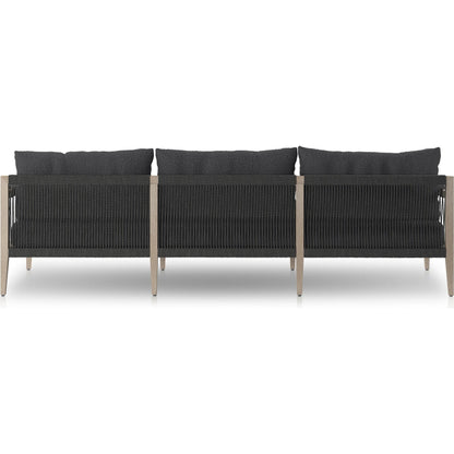 Sherwood Outdoor Sofa, Weathered Grey by Four Hands. Made from 100% olefin, solid fsc®-certified teak, 100% polypropylene in a coastal style.