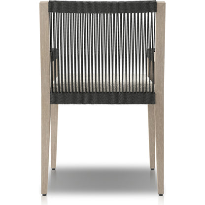 Sherwood Outdoor Dining Armchair, Weathered Grey by Four Hands. Made from 100% olefin, solid fsc®-certified teak, 100% polypropylene in a coastal style.