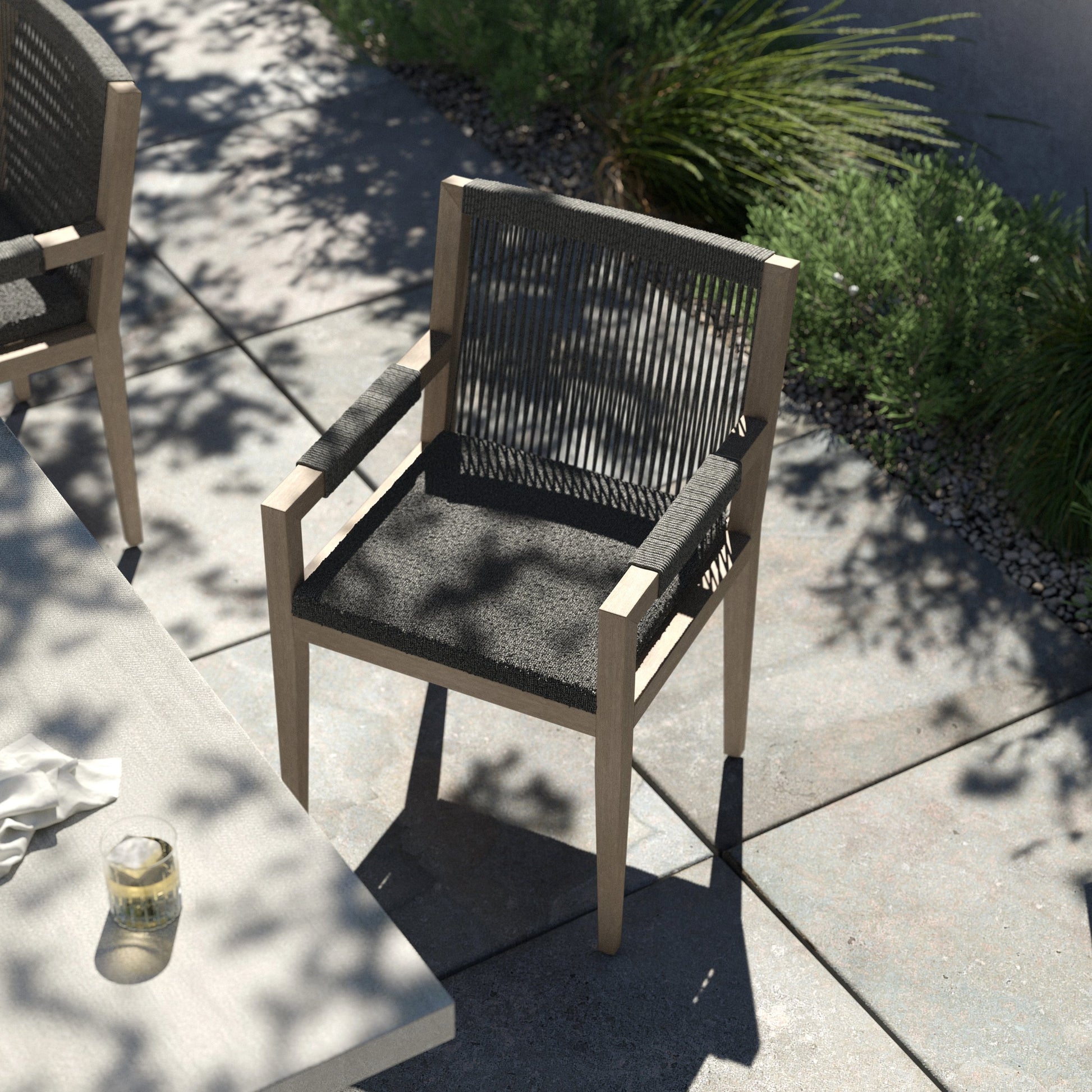 Sherwood Outdoor Dining Armchair, Weathered Grey by Four Hands. Made from 100% olefin, solid fsc®-certified teak, 100% polypropylene in a coastal style.