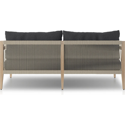 Sherwood Outdoor Sofa, Washed Brown by Four Hands. Made from 100% olefin, solid fsc®-certified teak, 100% polypropylene in a coastal style.