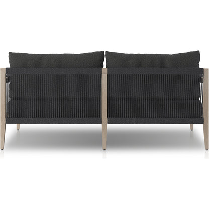 Sherwood Outdoor Sofa, Weathered Grey by Four Hands. Made from 100% olefin, solid fsc®-certified teak, 100% polypropylene in a coastal style.