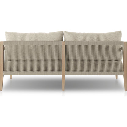 Sherwood Outdoor Sofa, Washed Brown by Four Hands. Made from 100% olefin, solid fsc®-certified teak, 100% polypropylene in a coastal style.