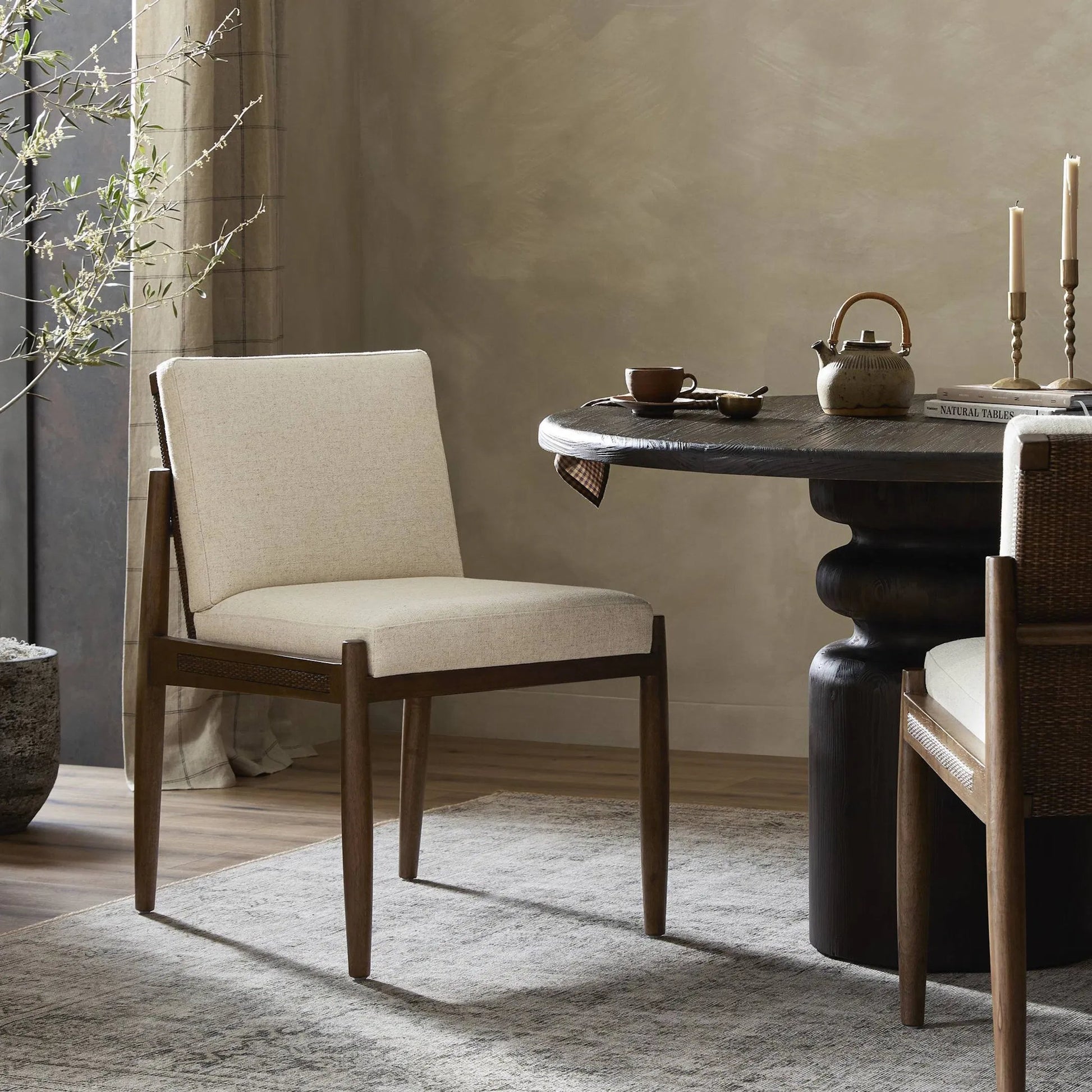 Costera Dining Chair by Four Hands in antwerp natural, almond, vintage cross woven cane. Made from 39% linen, 35% cotton, 26% polyester, solid parawood, cane in a transitional style.