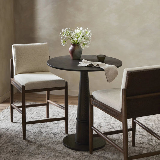 Costera Bar Stool by Four Hands in antwerp natural, almond, vintage cross woven cane. Made from 39% linen, 35% cotton, 26% polyester, solid parawood, cane in a traditional style.