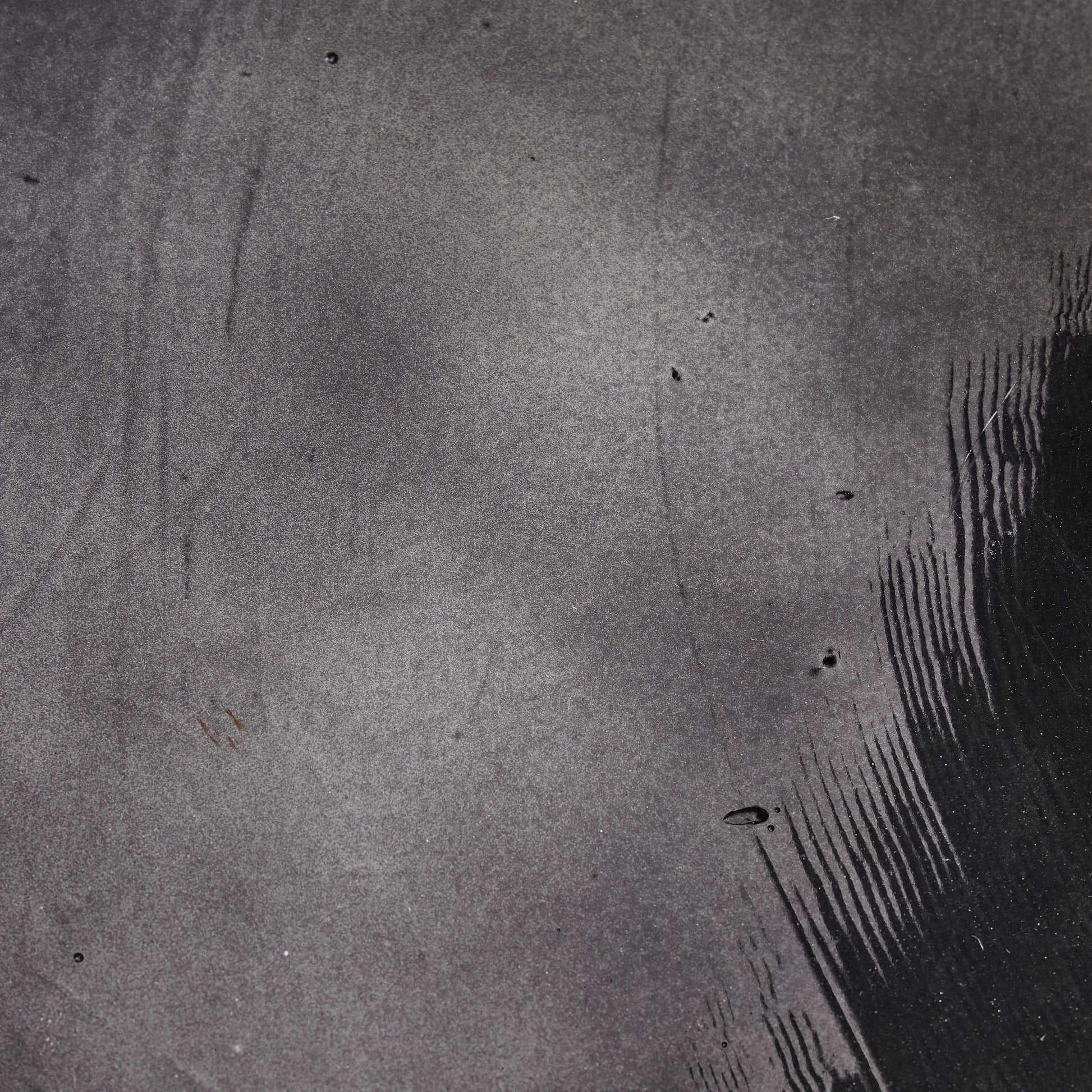 Ruben End Table by Four Hands in rustic brown, smoked black cast glass. Made from cast glass, iron in a modern style.