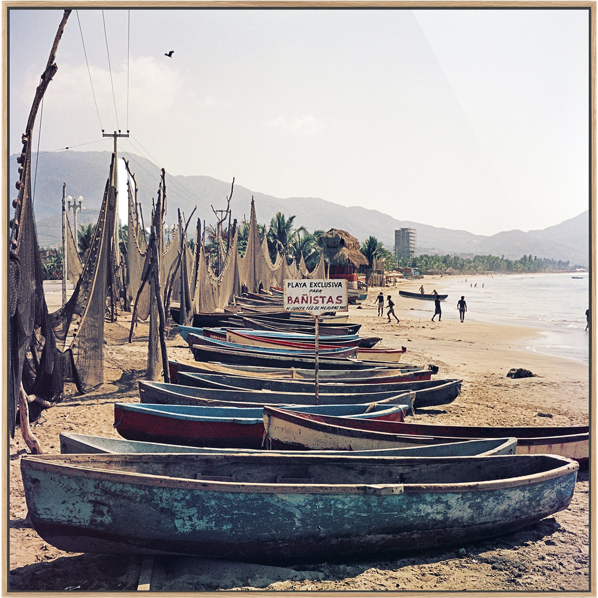Fishing Boats by Slim Aarons by Four Hands. Made from gloss white chromaluxe in a coastal style.