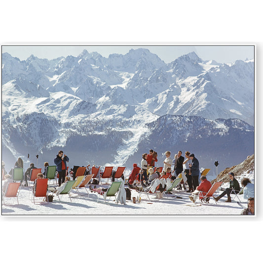 Lounging in Verbier by Slim Aarons by Four Hands. Made from white maple, gloss white chromaluxe in a modern style.