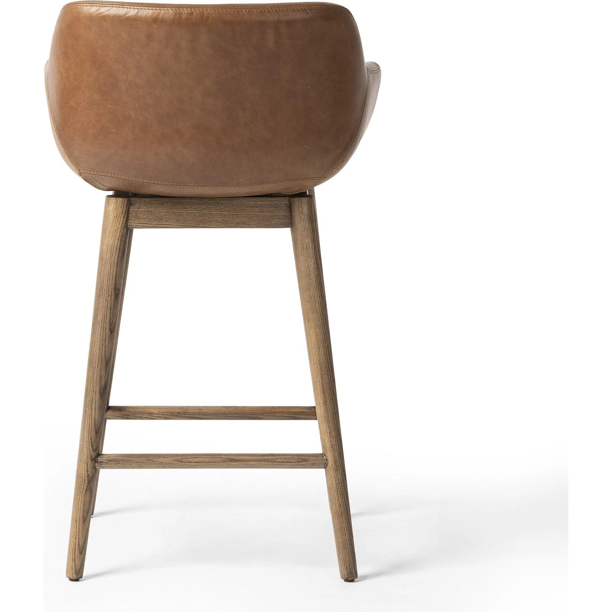 Hannah Swivel Counter Stool by Four Hands. Made from unique in a traditional style.