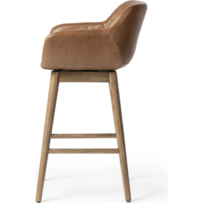Hannah Swivel Counter Stool by Four Hands. Made from unique in a traditional style.