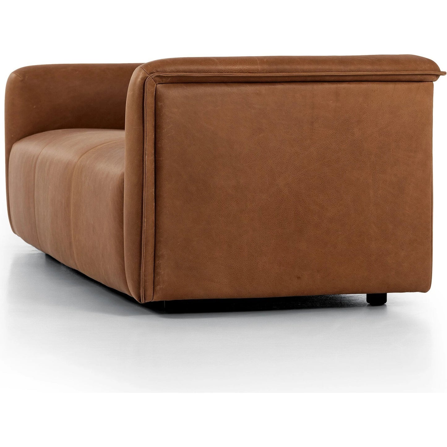 005 SI-2137704 | Closeup | Wellborn Sofa by Four Hands in palermo cognac. Made from top grain leather, poplar plywood, 100% polyester in a modern style.