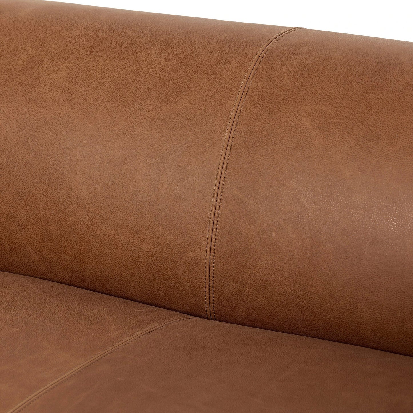 010 SI-2137704 | Closeup | Wellborn Sofa by Four Hands in palermo cognac. Made from top grain leather, poplar plywood, 100% polyester in a modern style.