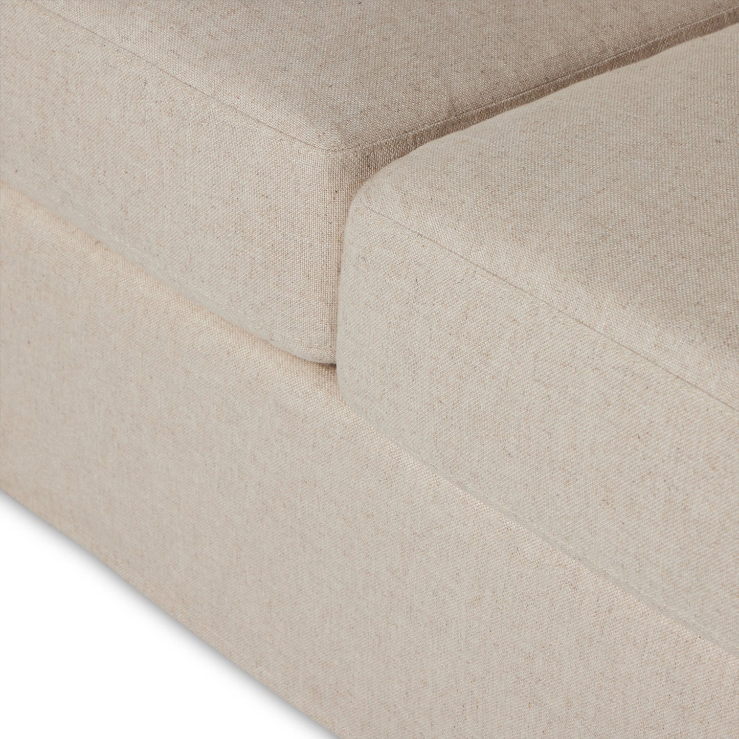 011 SI-2001429 | Closeup | Hampton Slipcover Sofa by Four Hands in evere oatmeal. Made from 51% rayon, 22% linen, 16% polyester, 11% cotton, pine plywood, 100% polyester in a modern style.