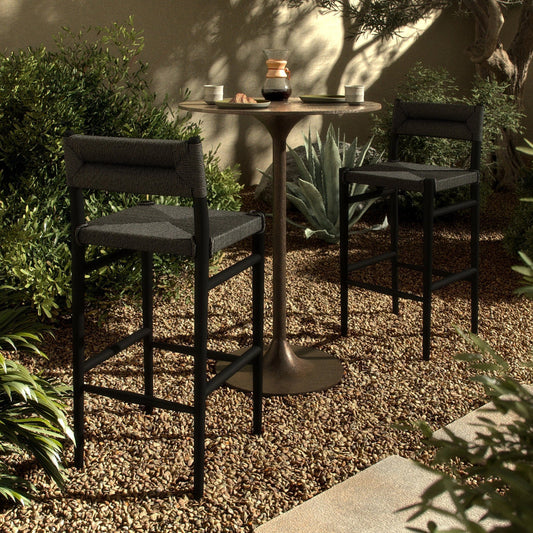 Lomas Outdoor Bar Stool by Four Hands in black teak, vintage coal. Made from solid teak, 100% polyethylene in a modern style.