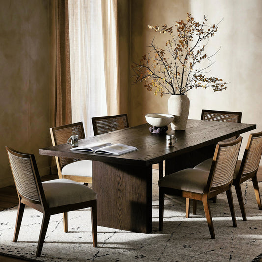 Torrington Dining Table by Four Hands in umber oak, umber oak veneer and umber oak. Made from resawn oak, oak veneer, engineered hardwood in a modern style.