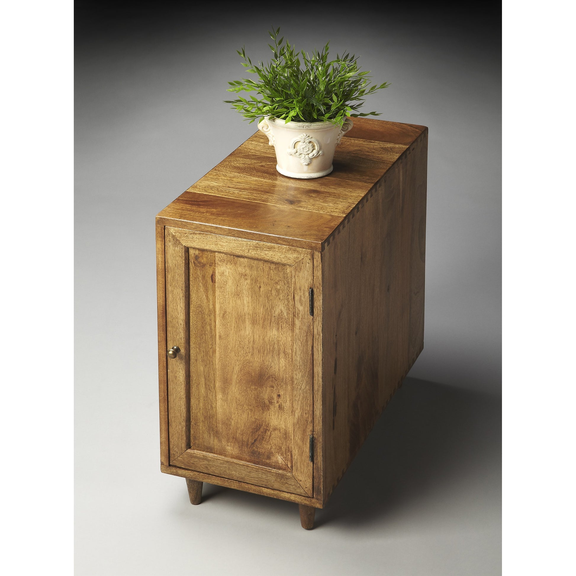 Conrad Modern Chairside Chest by Butler Specialty Company in light brown and modern expressions. Made from mango wood solids in a modern style.