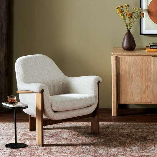 Santoro Chair by Four Hands in harrow ivory and lamont oak. Made from 47% polyester, 18% viscose, 30% acrylic, 5% linen, solid oak, 100% polyester in a modern style.