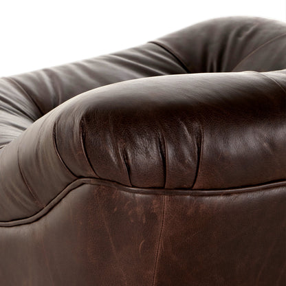 Farley Swivel Chair by Four Hands in conroe cigar. Made from top grain leather, poplar plywood, 100% polyester in a traditional style.