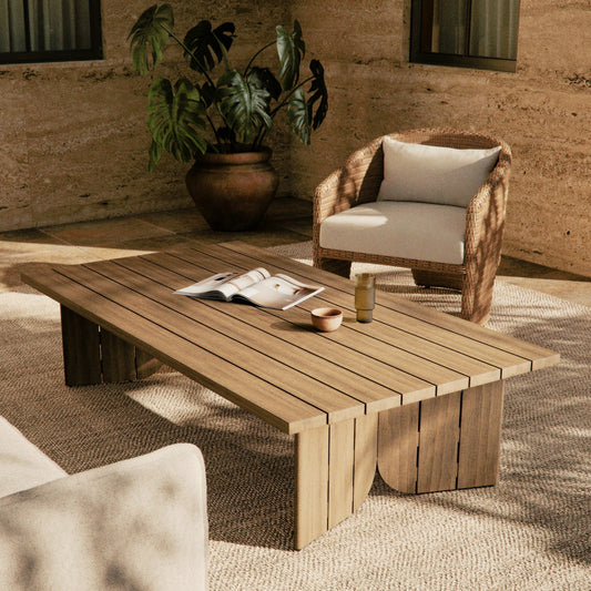 Joette Outdoor Coffee Table by Four Hands in washed brown. Made from solid fsc®-certified teak in a modern style.