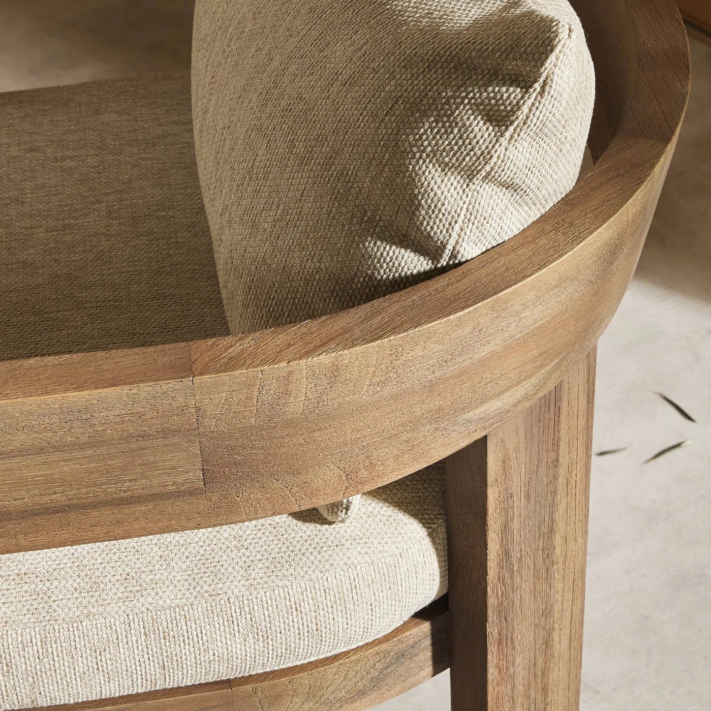 006 SI-2257095 | Closeup | Jackson Outdoor Dining Chair by Four Hands. Made from 100% olefin, solid fsc®-certified teak, 90% polyester fiber, 10% polyester fiber batting in a modern style.