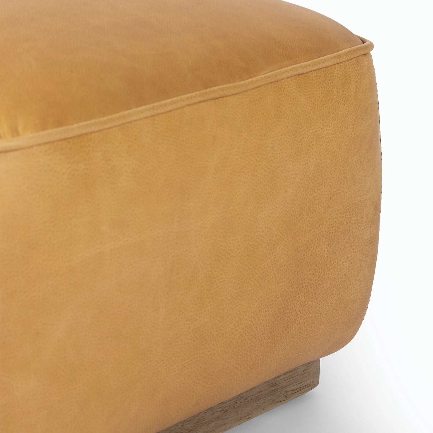 012 SI-2158481 | Closeup | Sinclair Square Ottoman-21" by Four Hands in palermo butterscotch, distressed natural. Made from top grain leather, solid parawood, 100% polyester in a modern style.