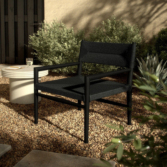 Lomas Outdoor Chair by Four Hands. Made from solid teak, 100% polyethylene in a modern style.