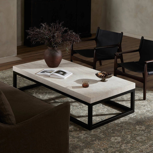 The Rectangular Coffee Table by Four Hands in travertine, bronze pebble texture. Made from solid travertine, iron in a modern style.