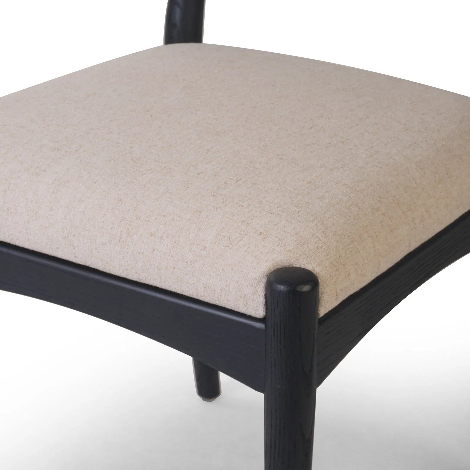 Haddon Dining Chair by Four Hands. Made from 39% linen, 35% cotton, 26% polyester, solid nettlewood, rush in a unique style.