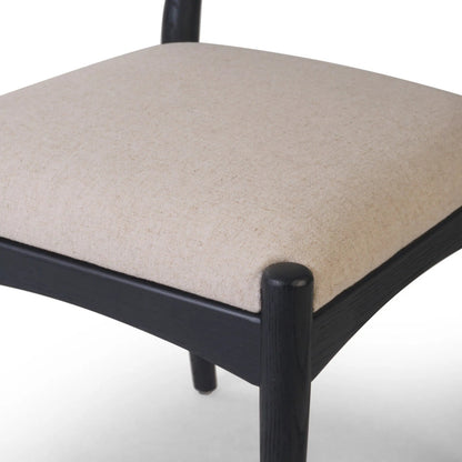 Haddon Dining Chair by Four Hands. Made from 39% linen, 35% cotton, 26% polyester, solid nettlewood, rush in a unique style.