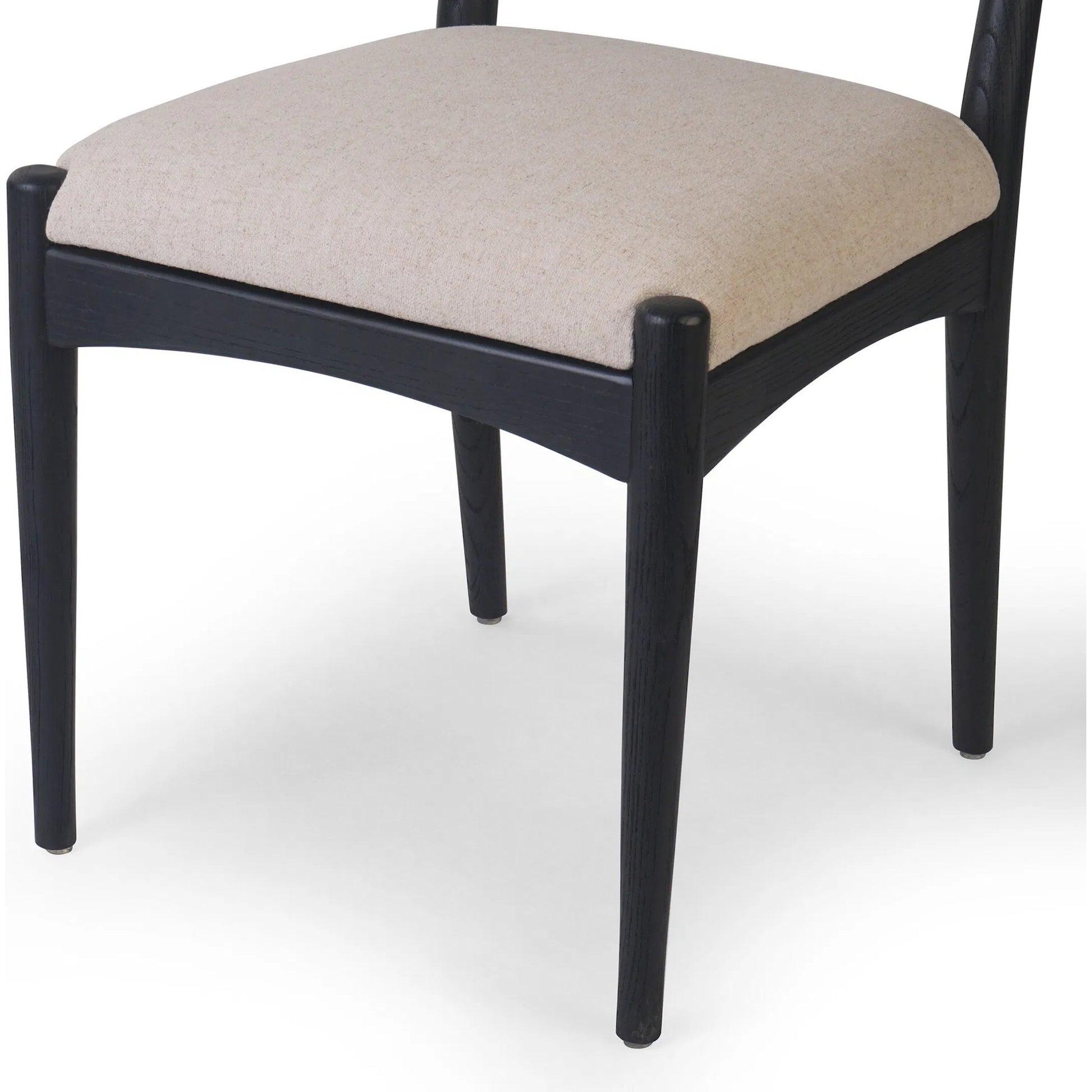 Haddon Dining Chair by Four Hands. Made from 39% linen, 35% cotton, 26% polyester, solid nettlewood, rush in a unique style.