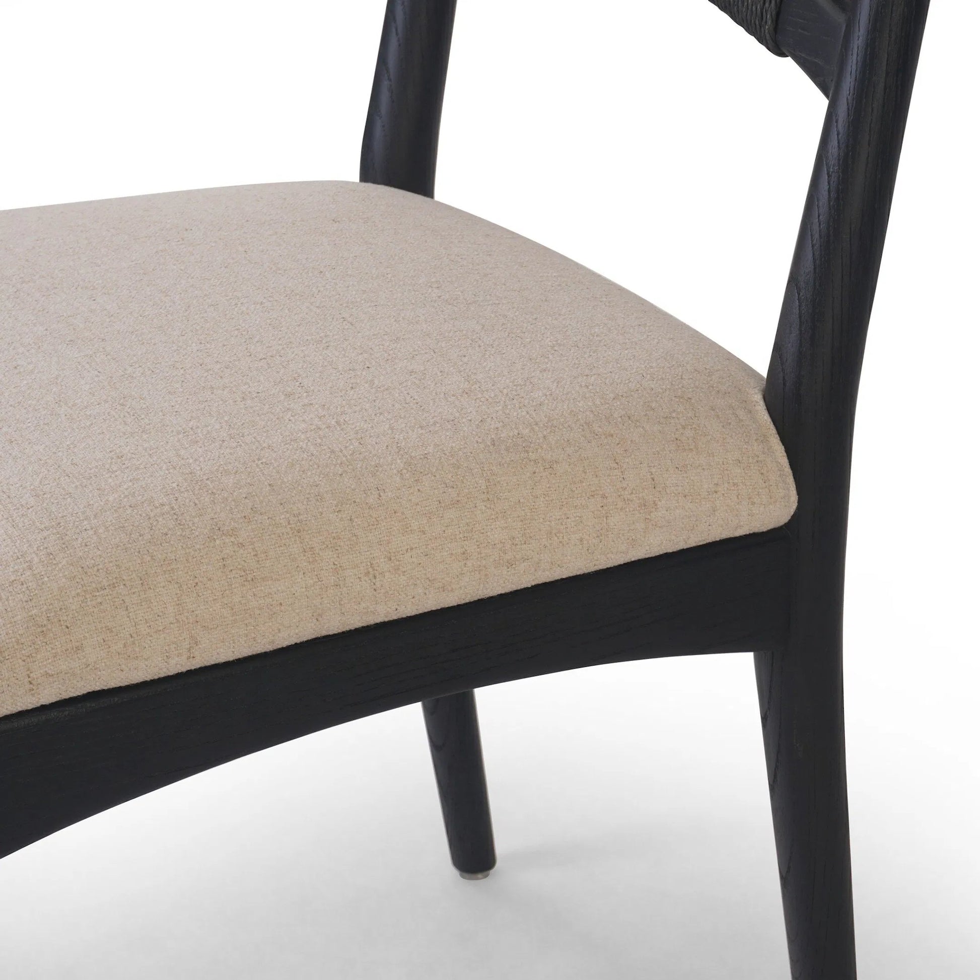 Haddon Dining Chair by Four Hands. Made from 39% linen, 35% cotton, 26% polyester, solid nettlewood, rush in a unique style.