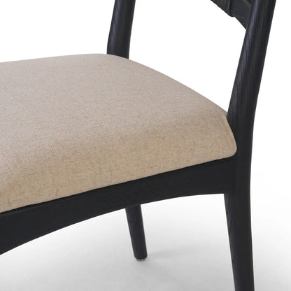 Haddon Dining Chair by Four Hands. Made from 39% linen, 35% cotton, 26% polyester, solid nettlewood, rush in a unique style.