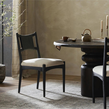 Haddon Dining Chair by Four Hands. Made from 39% linen, 35% cotton, 26% polyester, solid nettlewood, rush in a unique style.