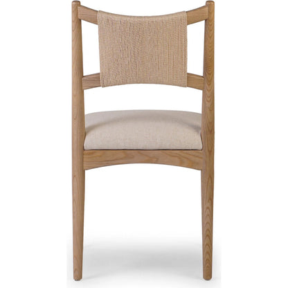 Haddon Dining Chair by Four Hands. Made from 39% linen, 35% cotton, 26% polyester, solid nettlewood, rush in a unique style.