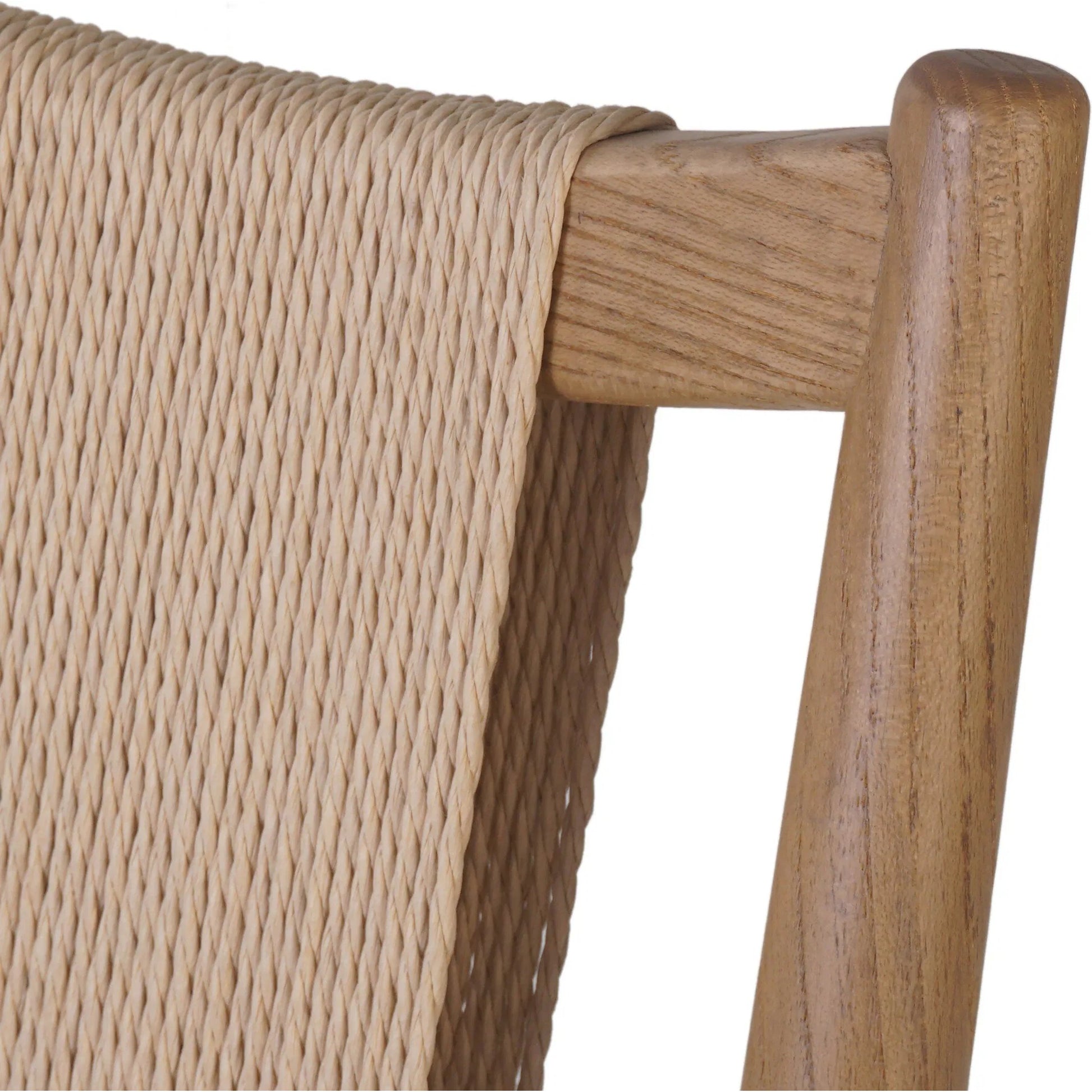 Haddon Dining Chair by Four Hands. Made from 39% linen, 35% cotton, 26% polyester, solid nettlewood, rush in a unique style.