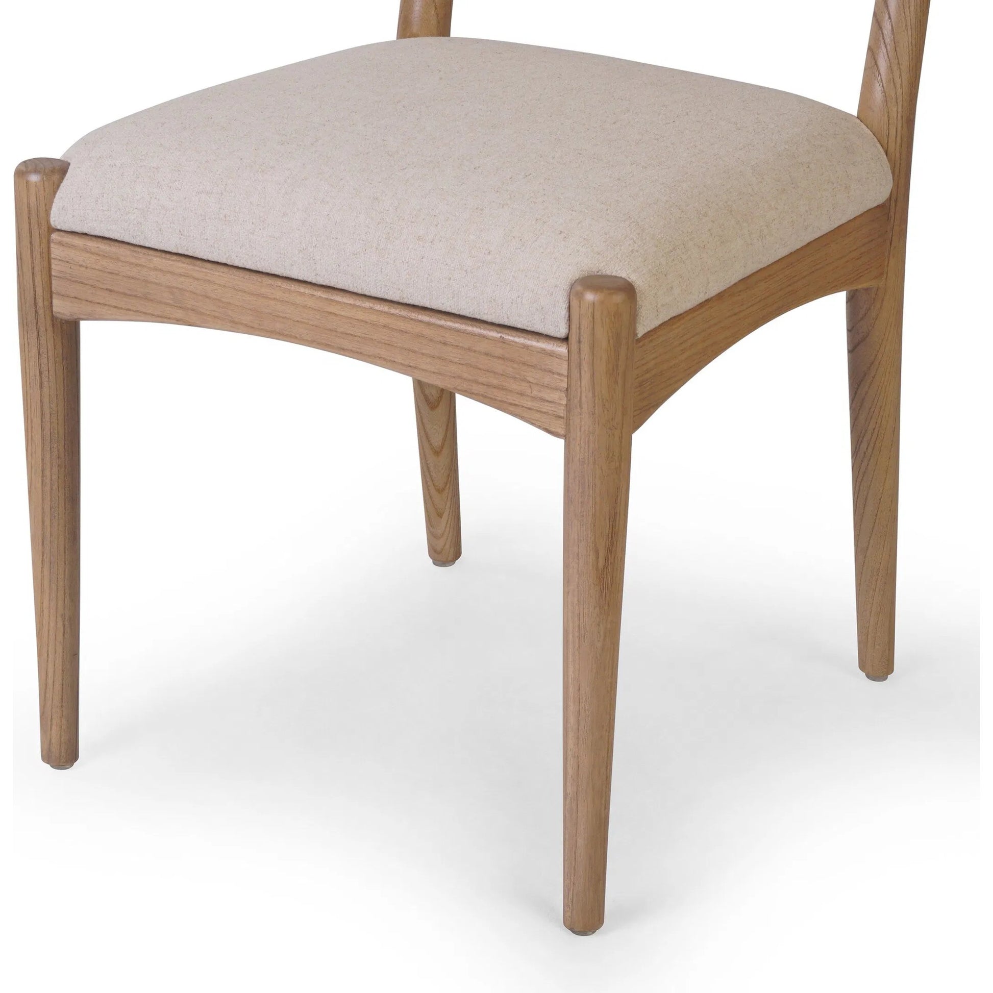 Haddon Dining Chair by Four Hands. Made from 39% linen, 35% cotton, 26% polyester, solid nettlewood, rush in a unique style.