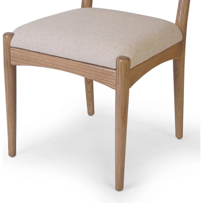 Haddon Dining Chair by Four Hands. Made from 39% linen, 35% cotton, 26% polyester, solid nettlewood, rush in a unique style.