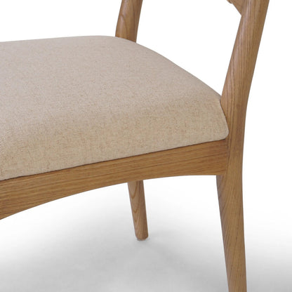 Haddon Dining Chair by Four Hands. Made from 39% linen, 35% cotton, 26% polyester, solid nettlewood, rush in a unique style.