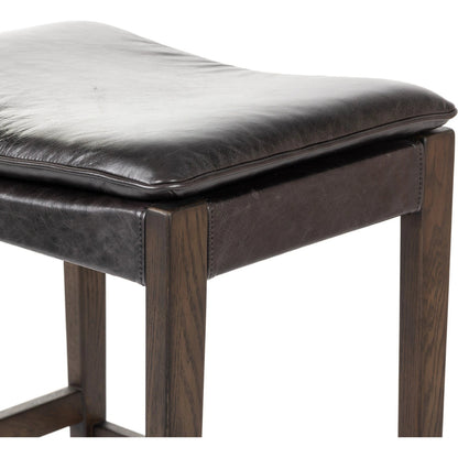 Aya Bar Stool by Four Hands in sonoma black and burnt oak. Made from top grain leather, solid oak, 100% polyester in a modern style.