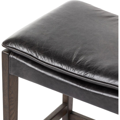 Aya Bar Stool by Four Hands in sonoma black and burnt oak. Made from top grain leather, solid oak, 100% polyester in a modern style.