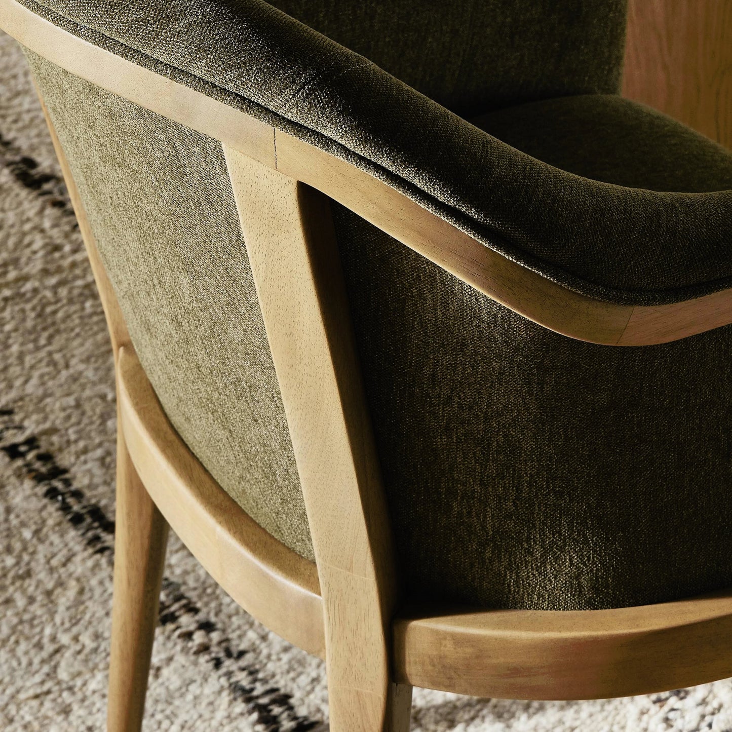 011 SI-2158116 | Closeup | Colston Dining Chair by Four Hands in sutton olive. Made from 100% polyester, solid parawood in a modern style.