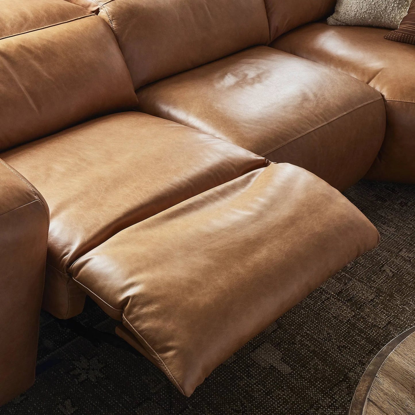 022 SI-2001827 | Closeup | Radley Power Recliner 5-Piece Sectional by Four Hands in sonoma butterscotch. Made from top grain leather, 100% polyester fiber, eucalyptus plywood in a modern style.