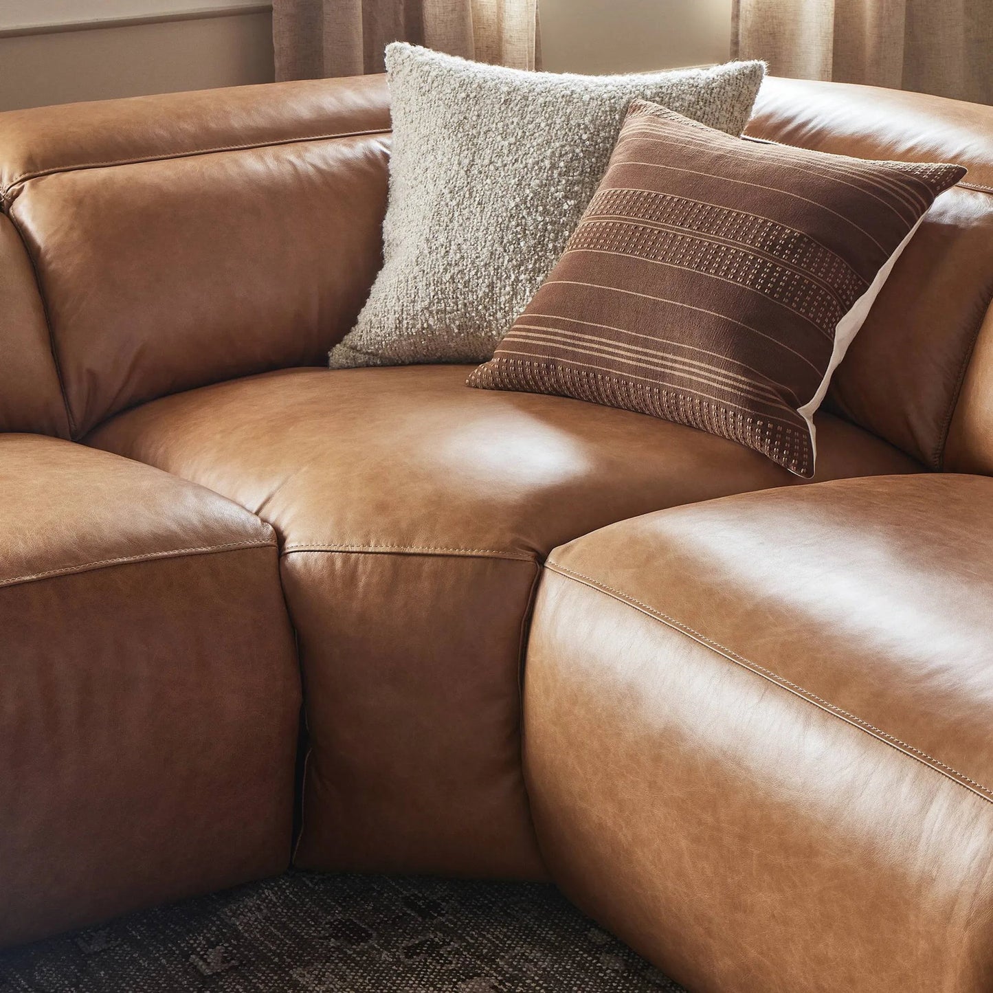 023 SI-2001827 | Closeup | Radley Power Recliner 5-Piece Sectional by Four Hands in sonoma butterscotch. Made from top grain leather, 100% polyester fiber, eucalyptus plywood in a modern style.