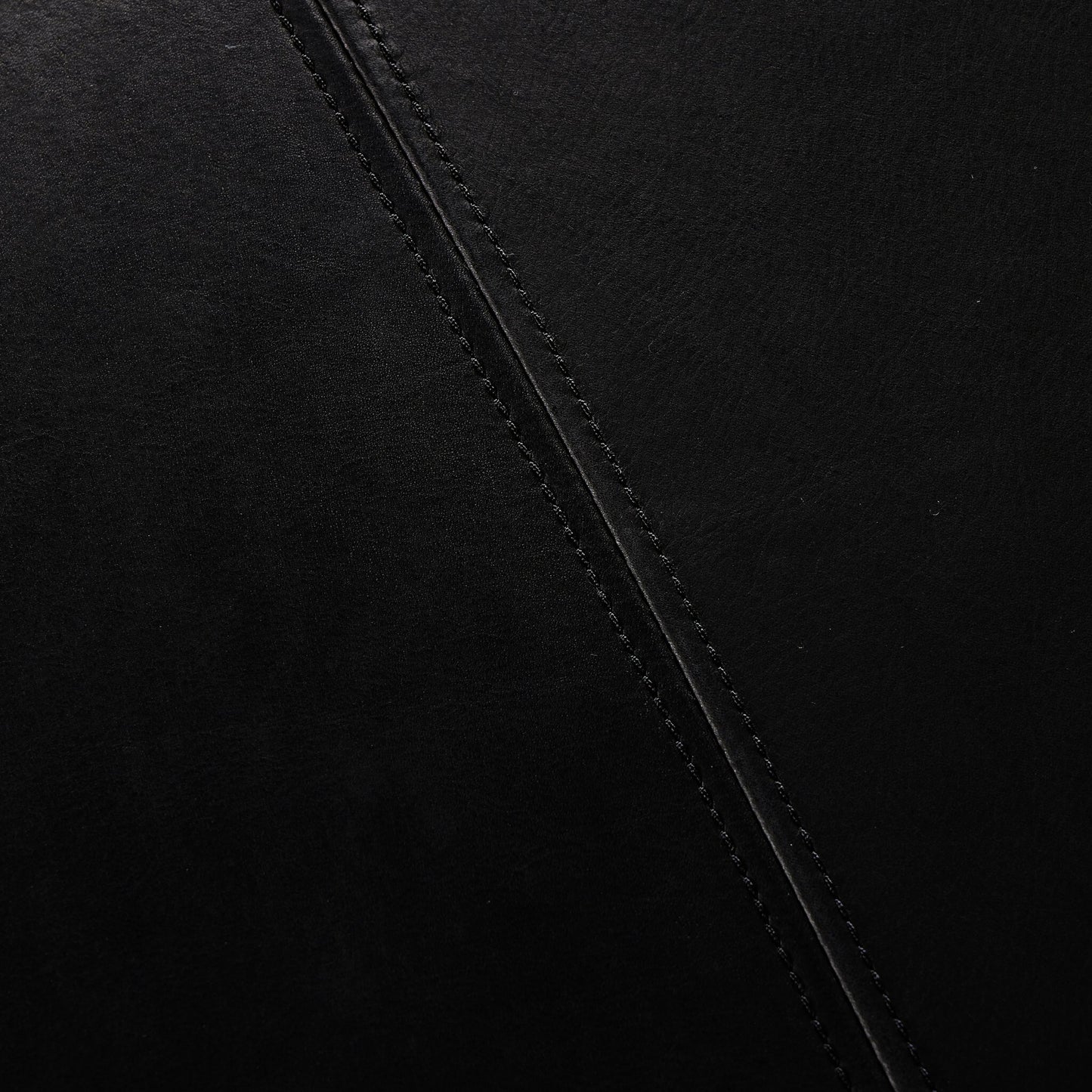 007 SI-2158070 | Closeup | Brickel Backless Bench by Four Hands in heirloom black. Made from top grain leather, iron, 100% polyester in a modern style.