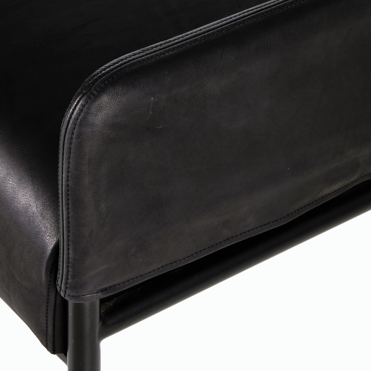 008 SI-2158070 | Closeup | Brickel Backless Bench by Four Hands in heirloom black. Made from top grain leather, iron, 100% polyester in a modern style.