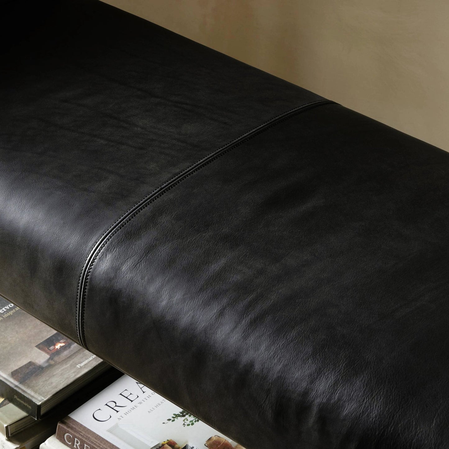 011 SI-2158070 | Closeup | Brickel Backless Bench by Four Hands in heirloom black. Made from top grain leather, iron, 100% polyester in a modern style.